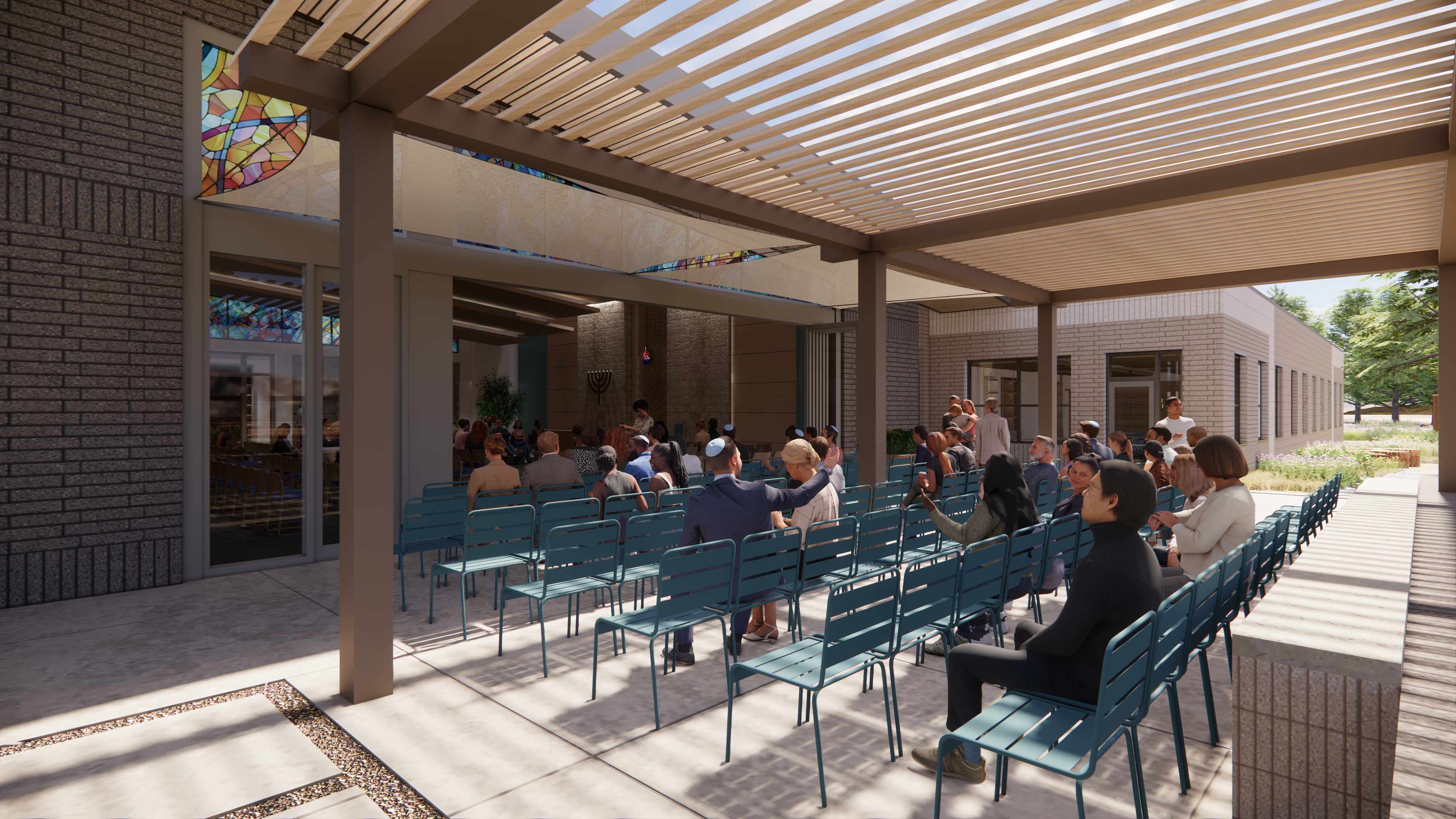 Outdoor High Holiday overflow seating under pergola with community gathered